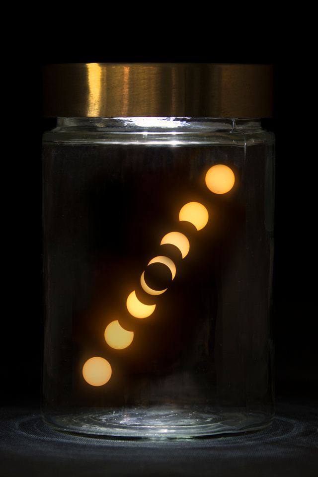 Solar eclipse in a jar