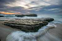 Fast moving water against stationary rock